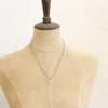 A mannequin wearing the layered talara pearl necklace