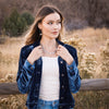 A model wearing the asmi full collar necklace and matching earrings