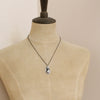 A mannequin wearing the apache gold necklace
