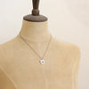 A mannequin wearing the big musana necklace