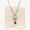 The black tourmaline jolie necklace styled on tan linen