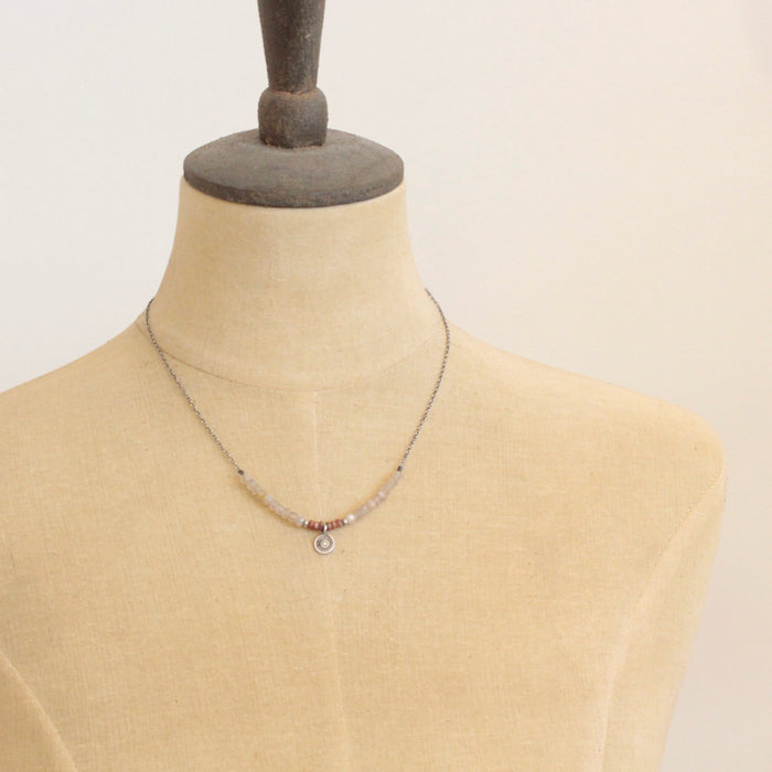 A mannequin wearing the talara sun zaria necklace