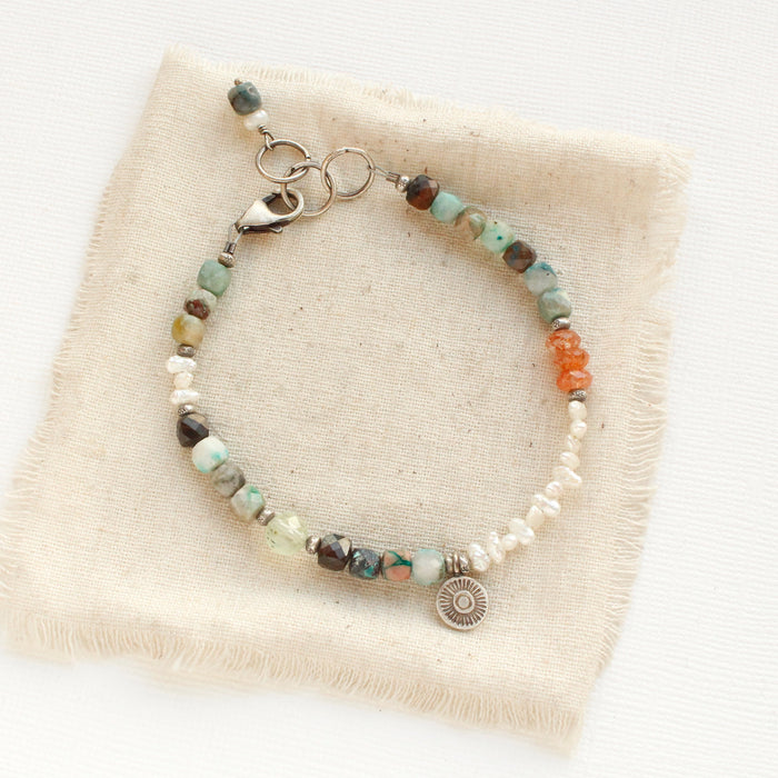 The talara sun mesa bracelet styled on tan linen