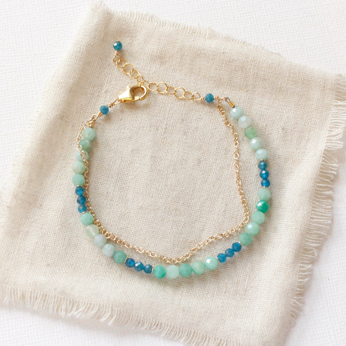 The lagoon double strand bracelet styled on tan linen