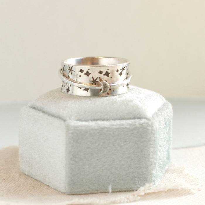 The galaxy spinner ring styled on a velvet box