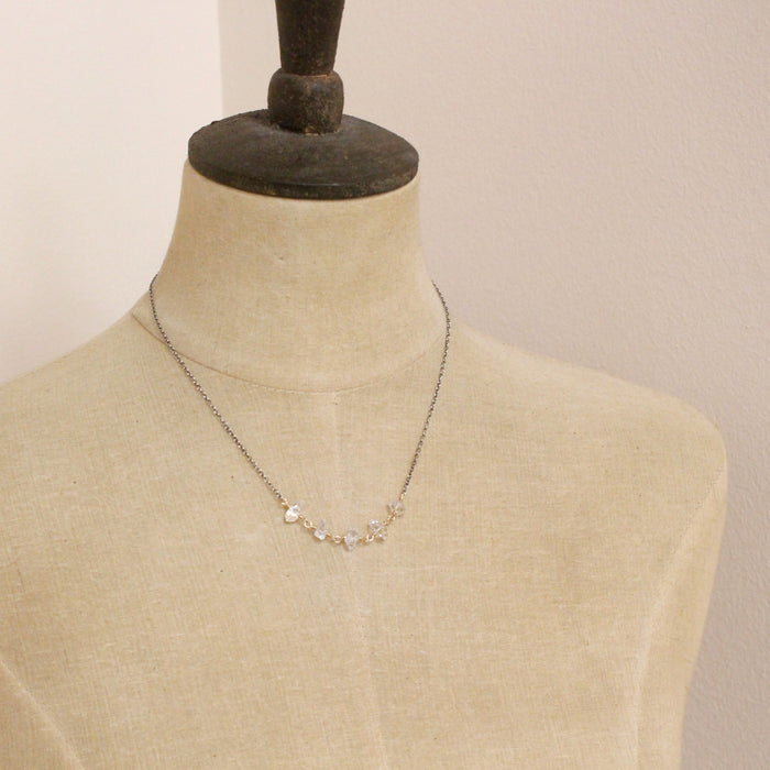 A mannequin wearing the mixed metal herkimer diamond necklace