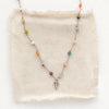 The knotted kaleidoscope necklace styled on tan silk