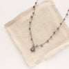 The knotted phosphosiderite mini cactus flower necklace styled on tan linen