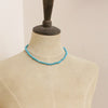 A mannequin wearing the sleeping beauty turquoise necklace