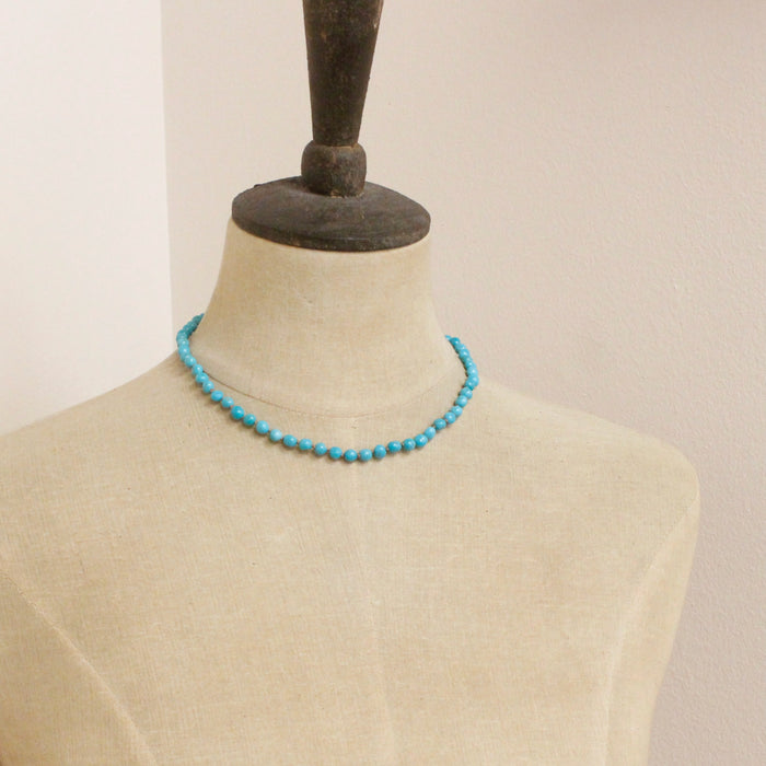 A mannequin wearing the sleeping beauty turquoise necklace