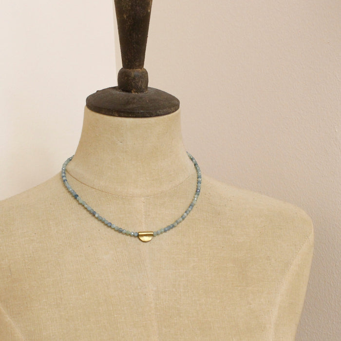 A mannequin wearing the beaded kyanite mythos necklace