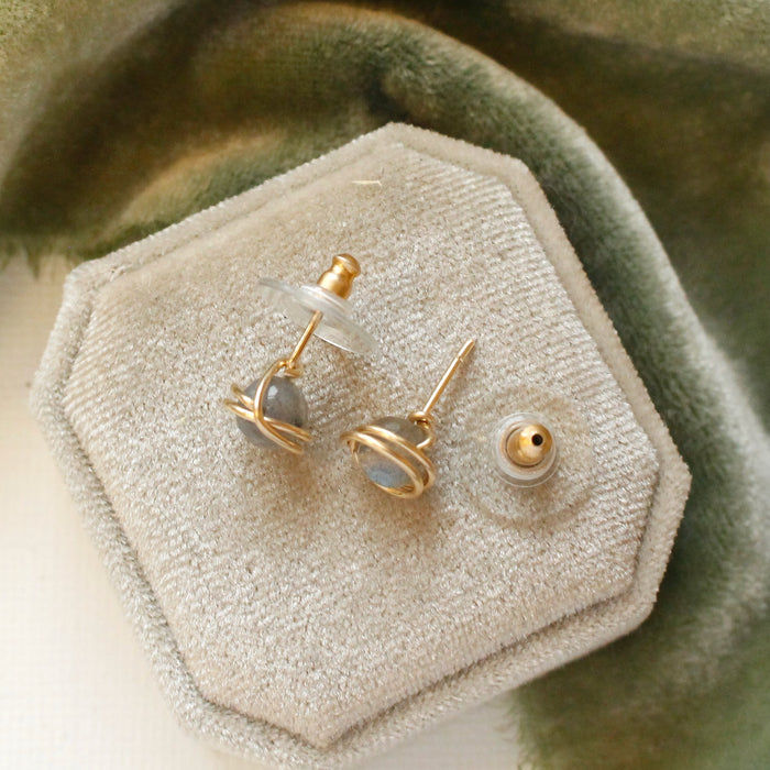 The gold wrapped labradorite post earrings styled to show the posts and comfort clutch ear backs