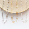 All three options of the paperclip necklaces styled on a tan plate