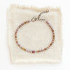 The phosphosidierite and ruby bracelet styled on tan silk