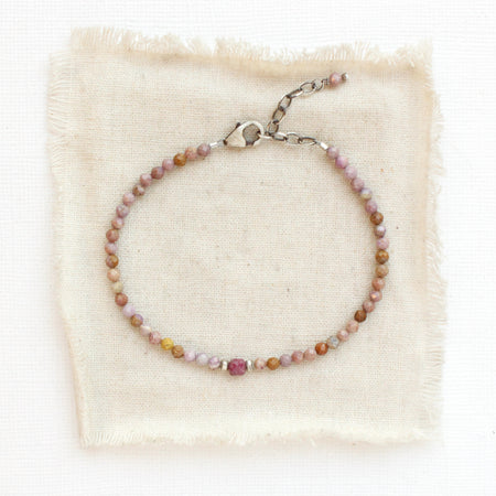 The phosphosidierite and ruby bracelet styled on tan silk