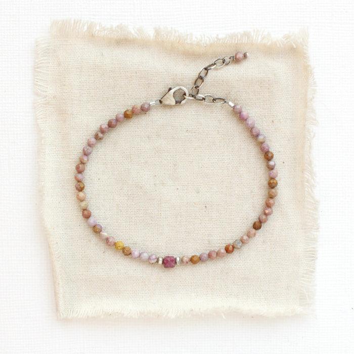 The phosphosidierite and ruby bracelet styled on tan silk