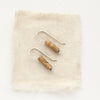 The picture jasper lobe hugger earrings styled on tan linen.