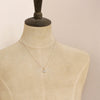 A mannequin wearing the pinned gold herkimer diamond necklace