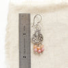 A shades of summer earring next to a ruler for size reference