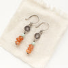 The stacked mesa talara sun earrings styled on tan linen