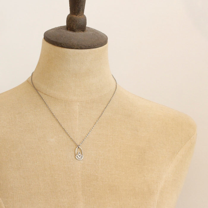 A mannequin wearing the wanderer hoop necklace
