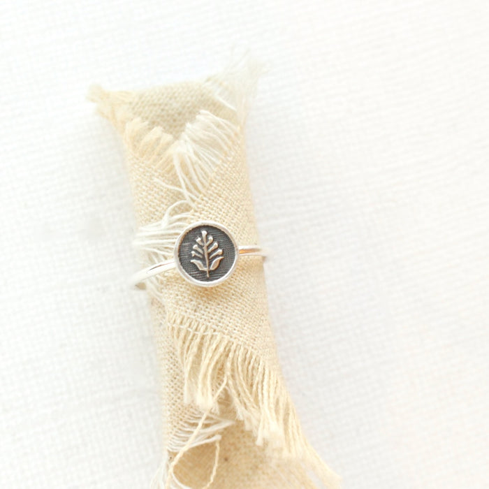 The back to the garden stacking ring styled on tan linen