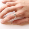 The talara sun ring being worn on a hand