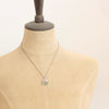 A mannequin wearing the turquoise fringe pakal arch necklace