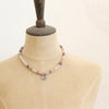 A mannequin wearing the layered cactus flower violet jade necklace
