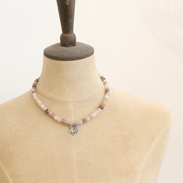 A mannequin wearing the layered cactus flower violet jade necklace