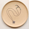 The layered talara necklace styled to show the adjustable lobster clasp closure