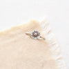 The little sun mixed metal ring styled on tan linen