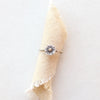 The little sun mixed metal ring styled on tan linen