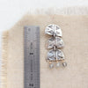 A pakal trio labradorite post earring next to a ruler for size reference